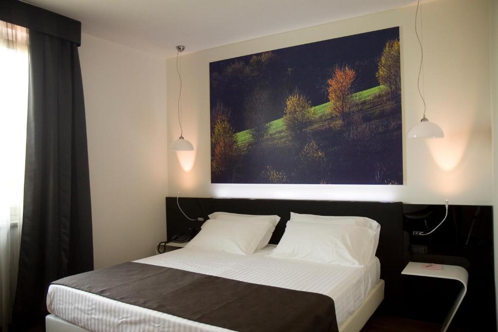 Postel nebo postele na pokoji v ubytování HM MotelHotel