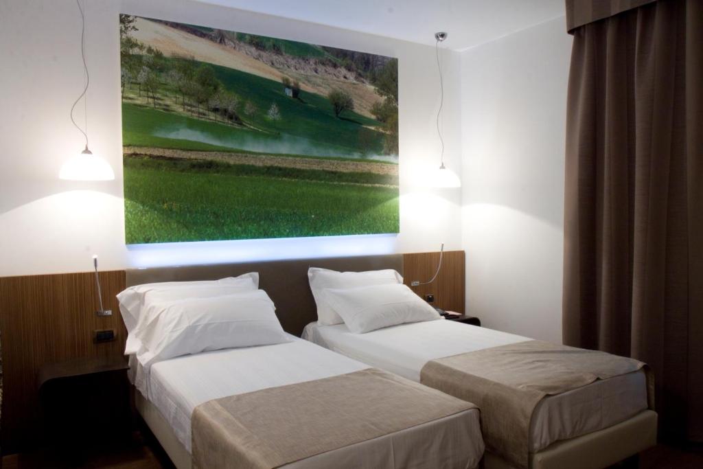 Postel nebo postele na pokoji v ubytování HM MotelHotel
