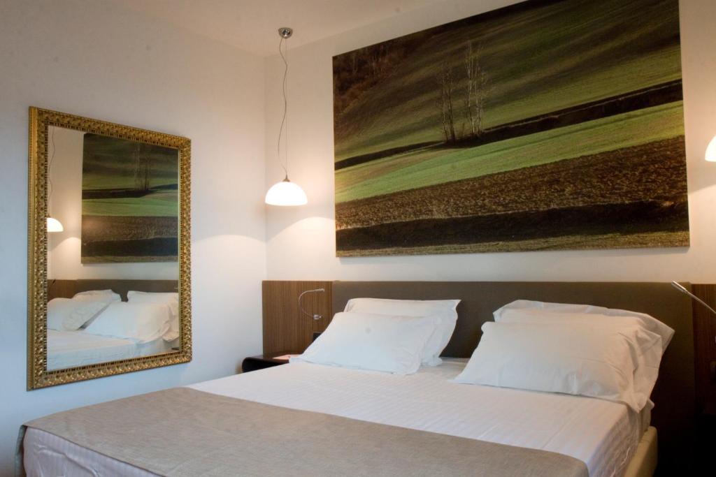 Postel nebo postele na pokoji v ubytování HM MotelHotel