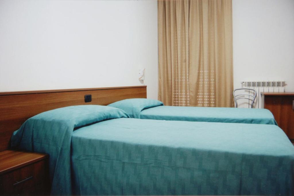 Postel nebo postele na pokoji v ubytování B&B La Collina