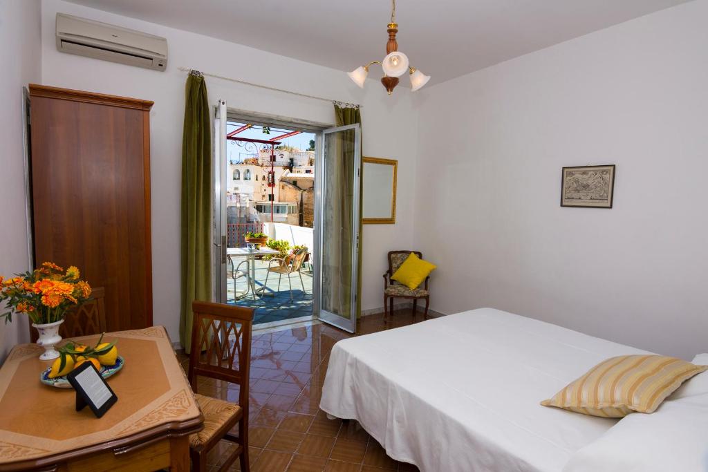 Postel nebo postele na pokoji v ubytování Casa Maresca Residence