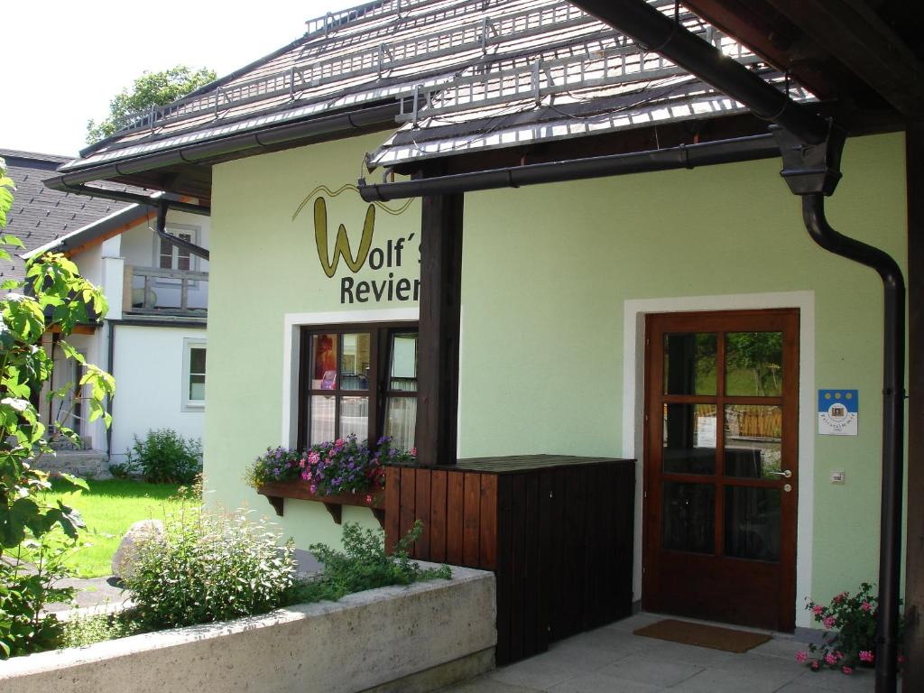 a building with a sign that reads work review at Wolfs Revier in Lackenhof