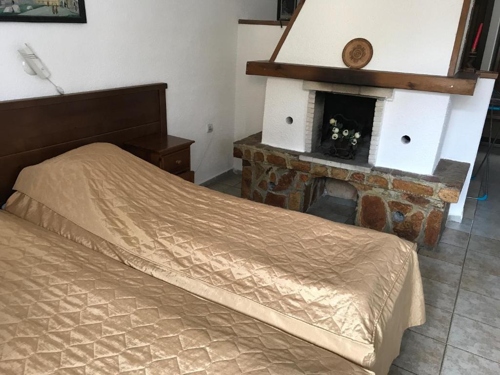 Postel nebo postele na pokoji v ubytování Durchova Kashta Family Hotel