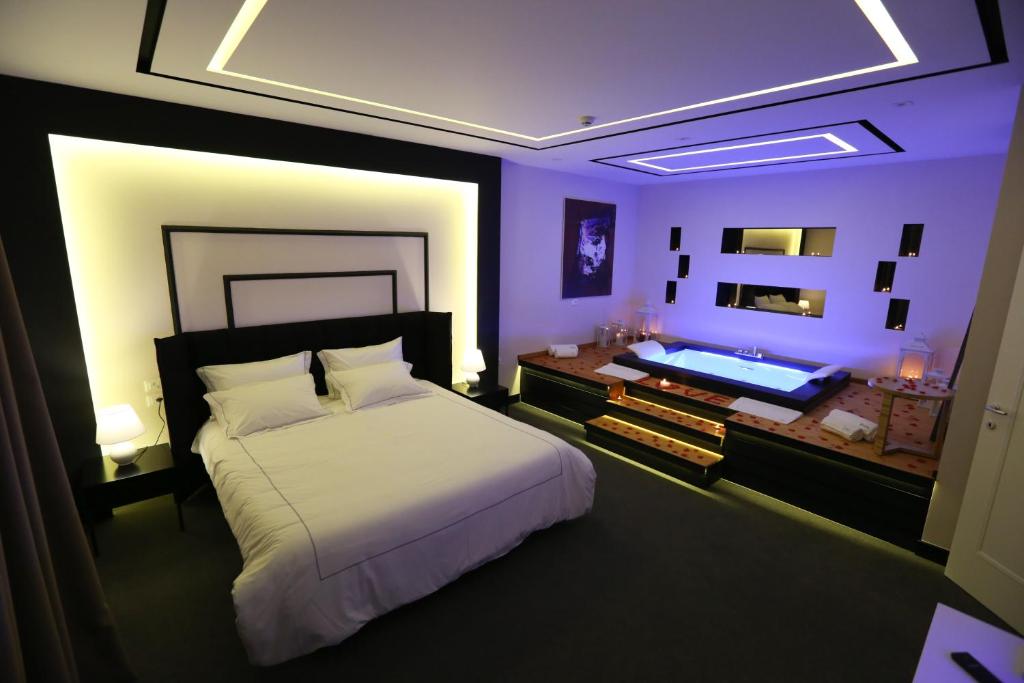 Postel nebo postele na pokoji v ubytování Hotel Delta Premium