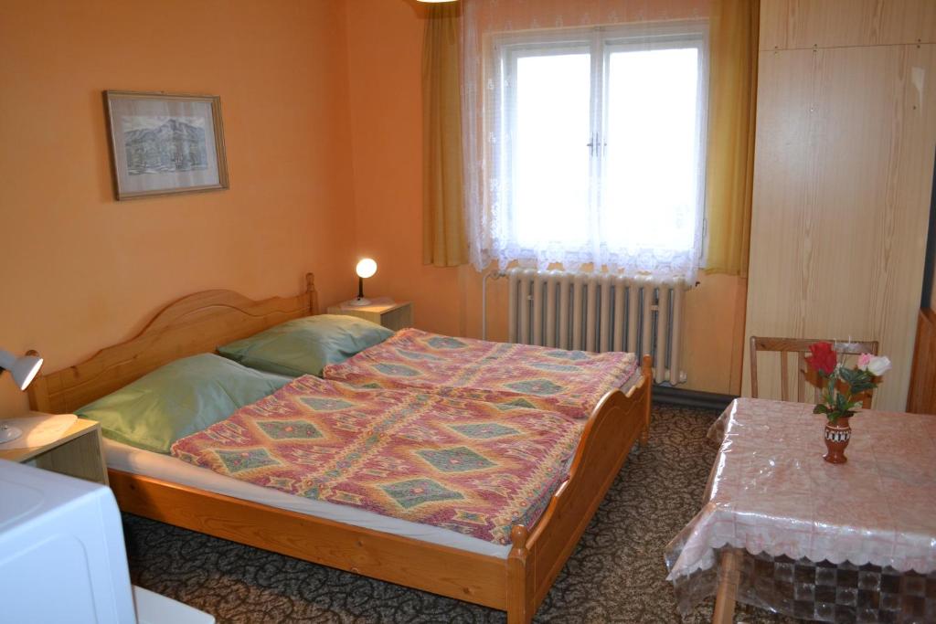 Postel nebo postele na pokoji v ubytování Penzion Hainiš