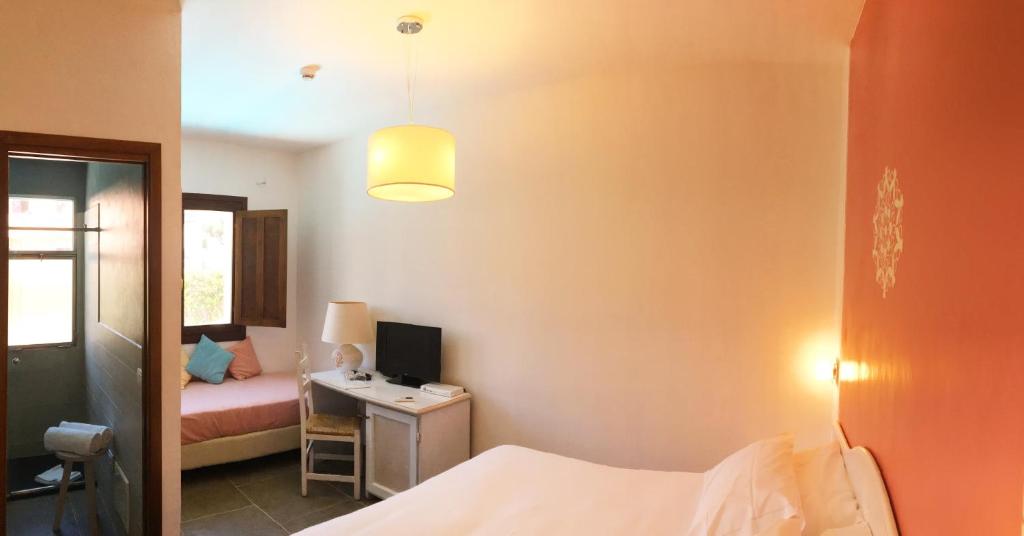 Postel nebo postele na pokoji v ubytování Boutique Hotel Sant'Andrea & Relais