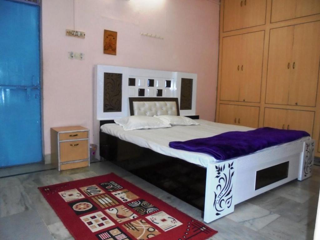Postel nebo postele na pokoji v ubytování Sunita homestay