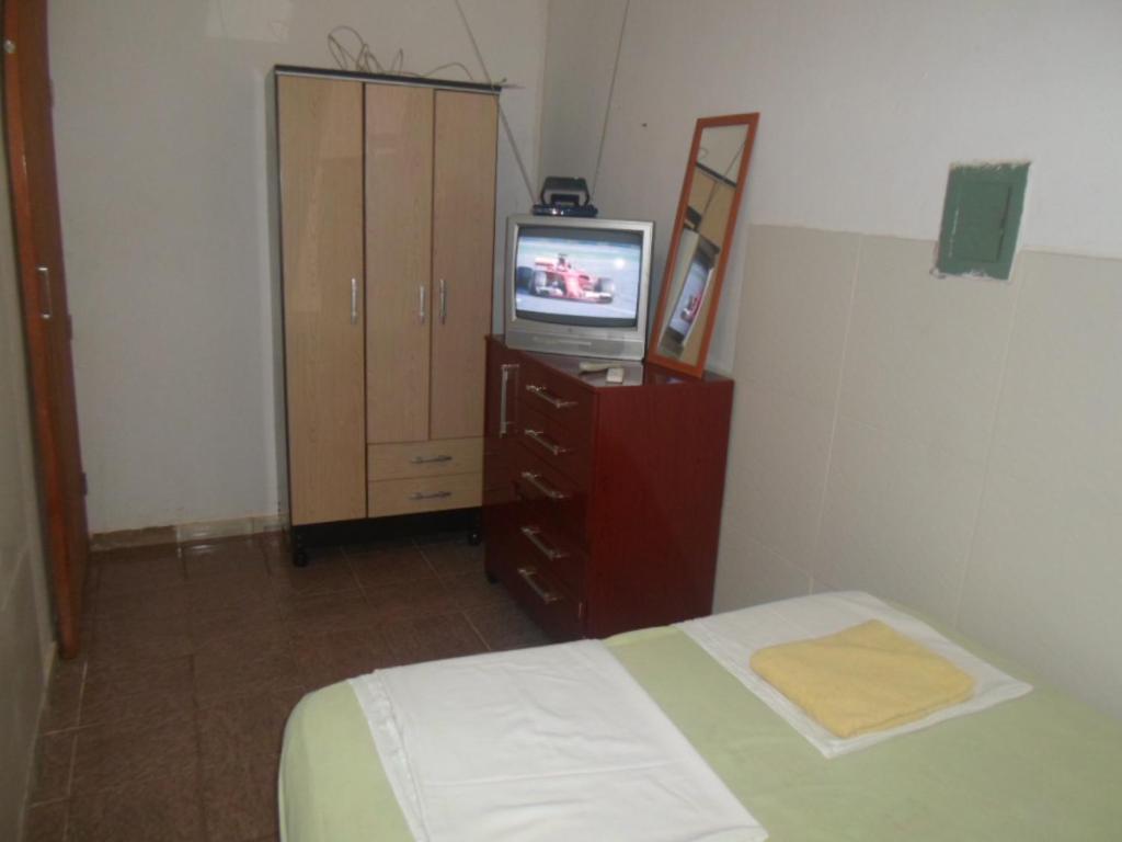 A bed or beds in a room at Hotel Palmas Tocantins