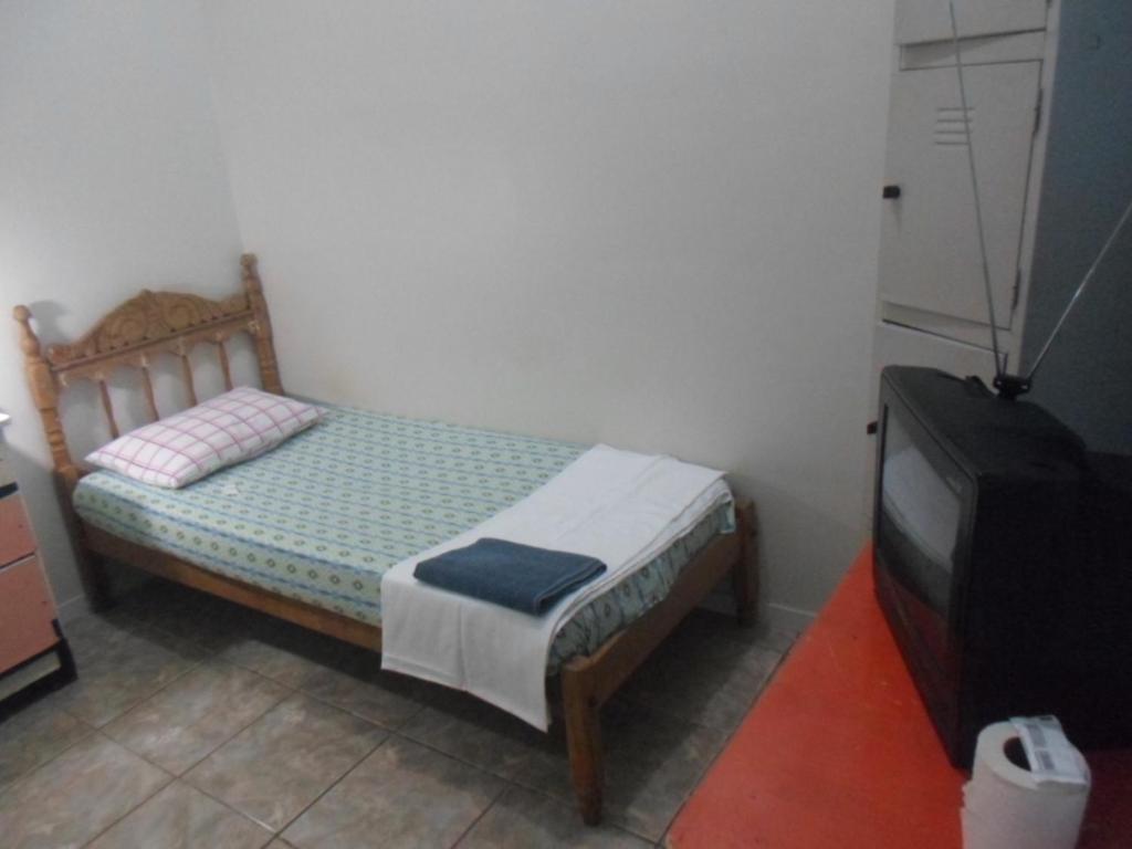 A bed or beds in a room at Hotel Palmas Tocantins