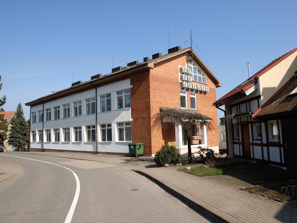 a brick building on the side of a street at Studio Relax in Nida