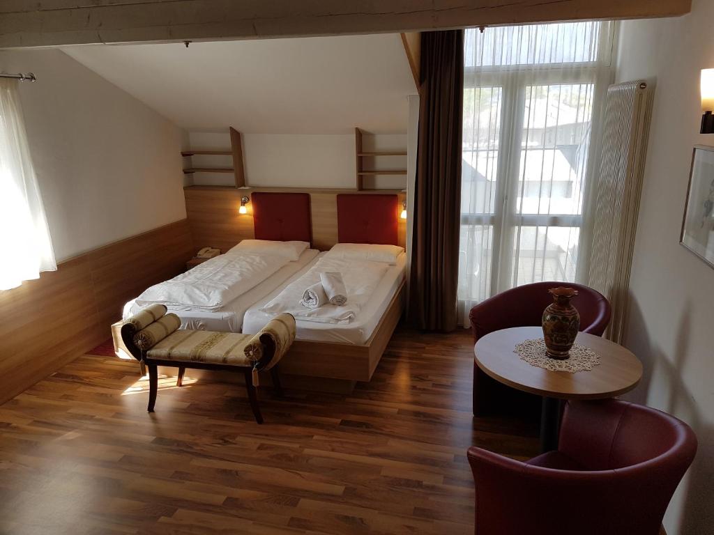 Postel nebo postele na pokoji v ubytování Hotel Andreas Hofer