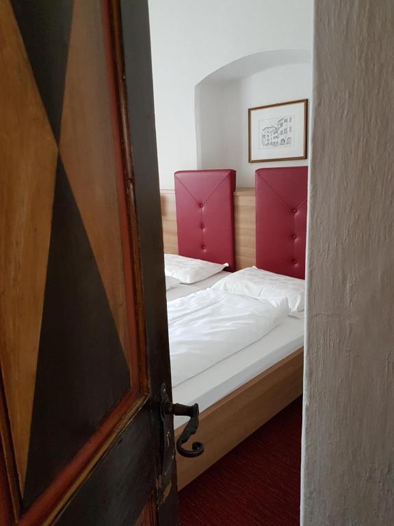 Postel nebo postele na pokoji v ubytování Hotel Andreas Hofer