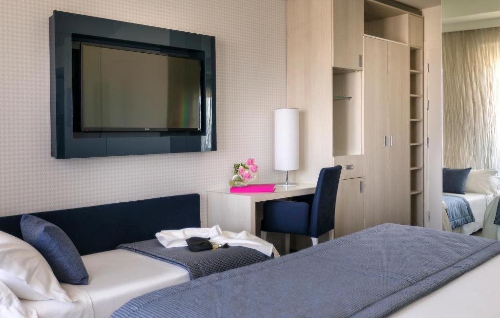 Postel nebo postele na pokoji v ubytování Hotel Nautico