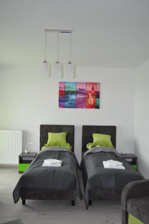 Posteľ alebo postele v izbe v ubytovaní Pop Art Apartments