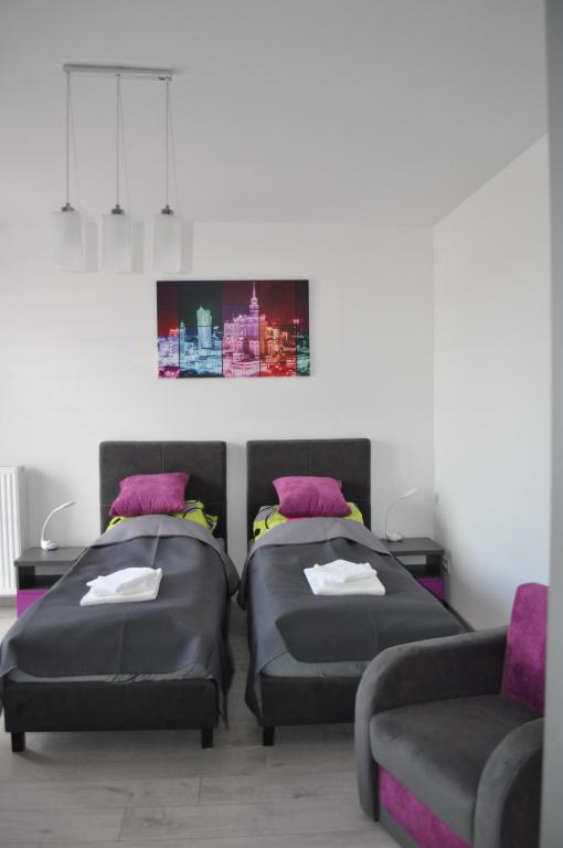 Posteľ alebo postele v izbe v ubytovaní Pop Art Apartments