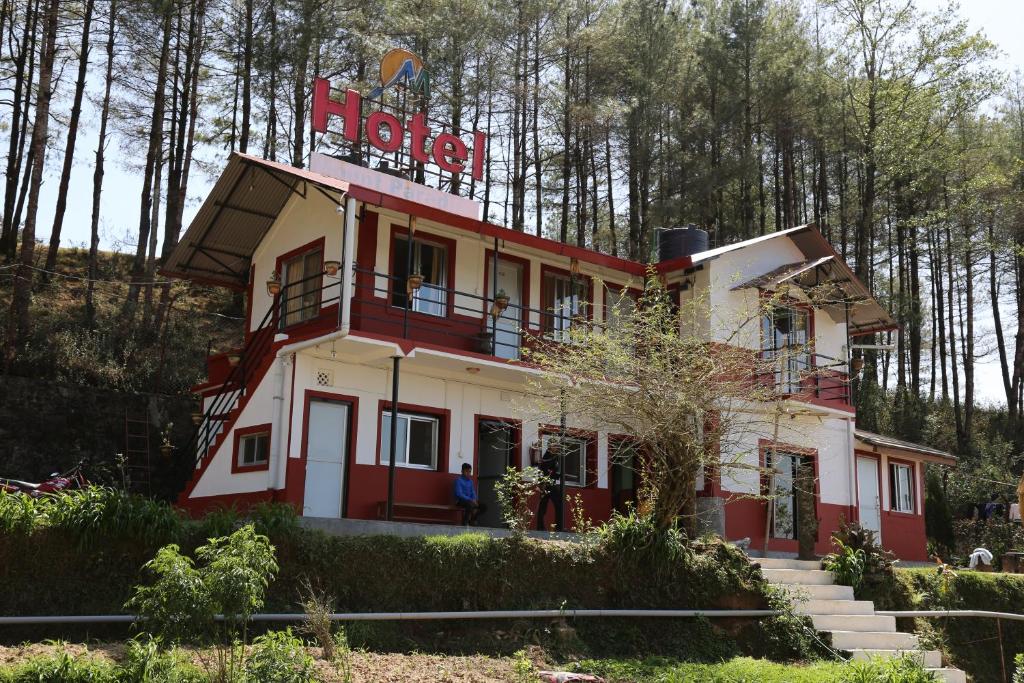 a building with a sign on top of it at Hotel Mount Paradise in Nagarkot