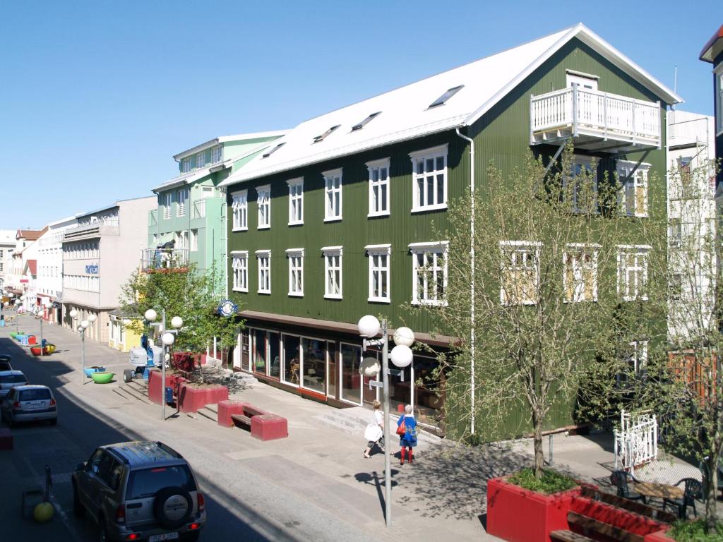 
a large building with a large window on the side of the building at Akureyri Backpackers in Akureyri
