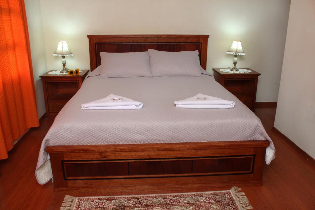 Postel nebo postele na pokoji v ubytování Hosteria San Carlos Tababela