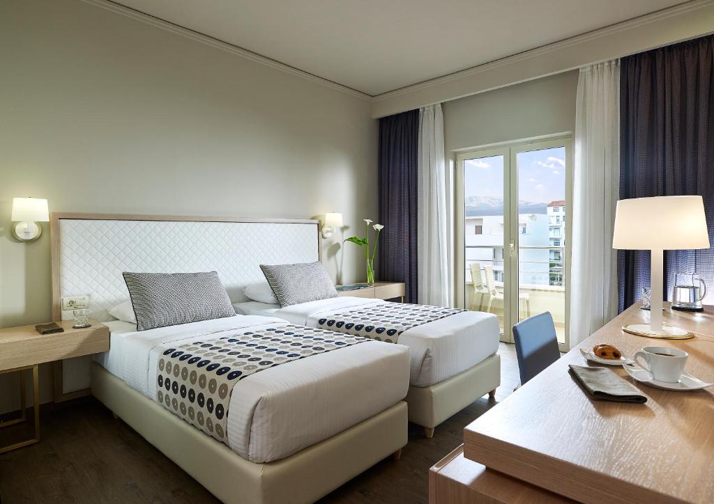 Postel nebo postele na pokoji v ubytování Irida Hotel