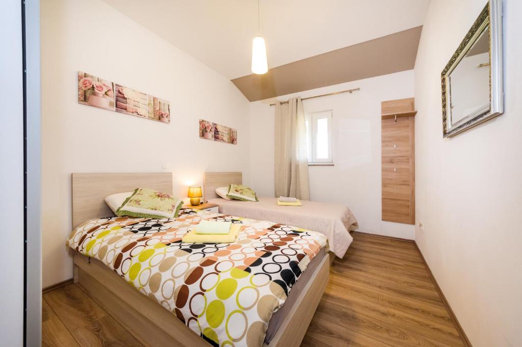 Posteľ alebo postele v izbe v ubytovaní Apartment Verunica
