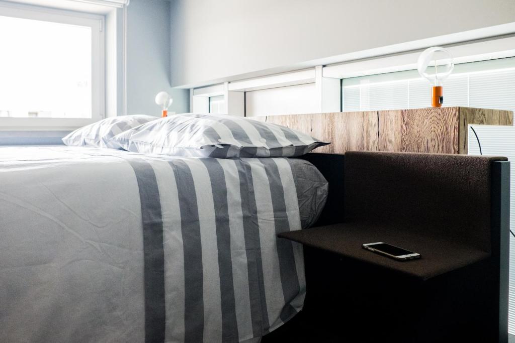 Postel nebo postele na pokoji v ubytování Grey Loft