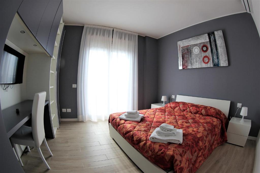 Łóżko lub łóżka w pokoju w obiekcie Residenze Italia