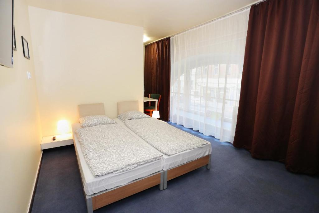 Postel nebo postele na pokoji v ubytování Mezzo Budapest
