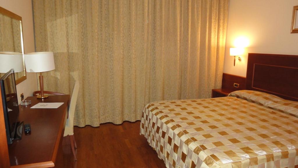 Posteľ alebo postele v izbe v ubytovaní Hotel Marconi
