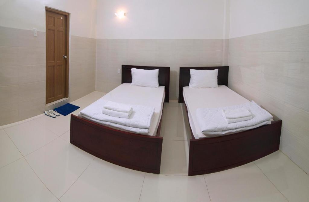 Postel nebo postele na pokoji v ubytování HaiVan HosTel