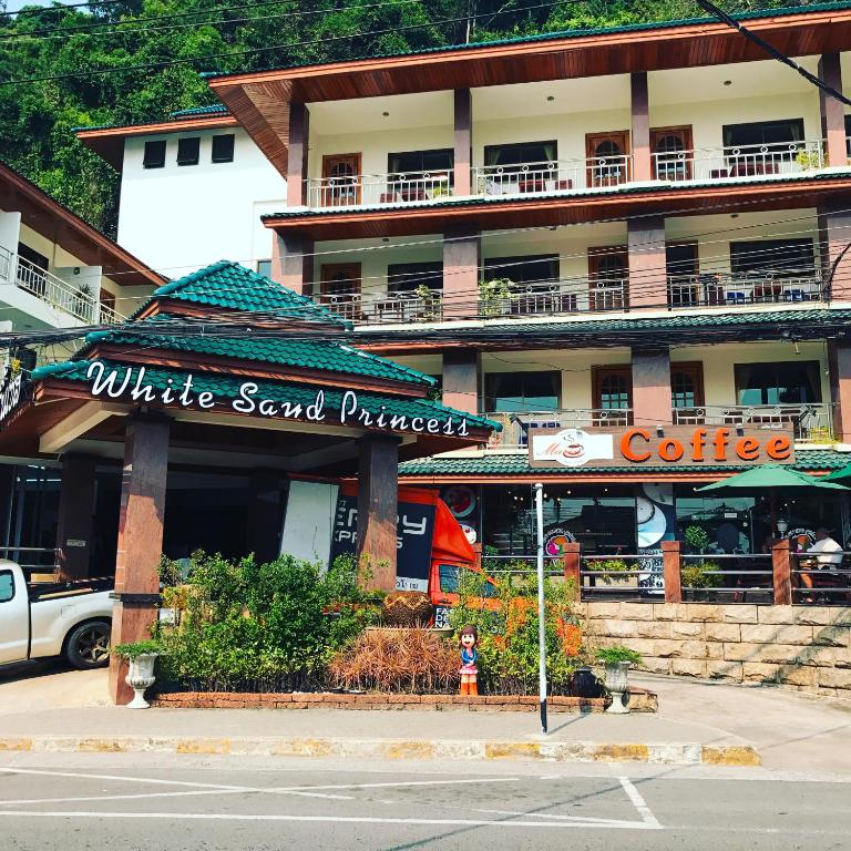 a building with a white sand purchase sign in front of it at White Sand Princess in Ko Chang
