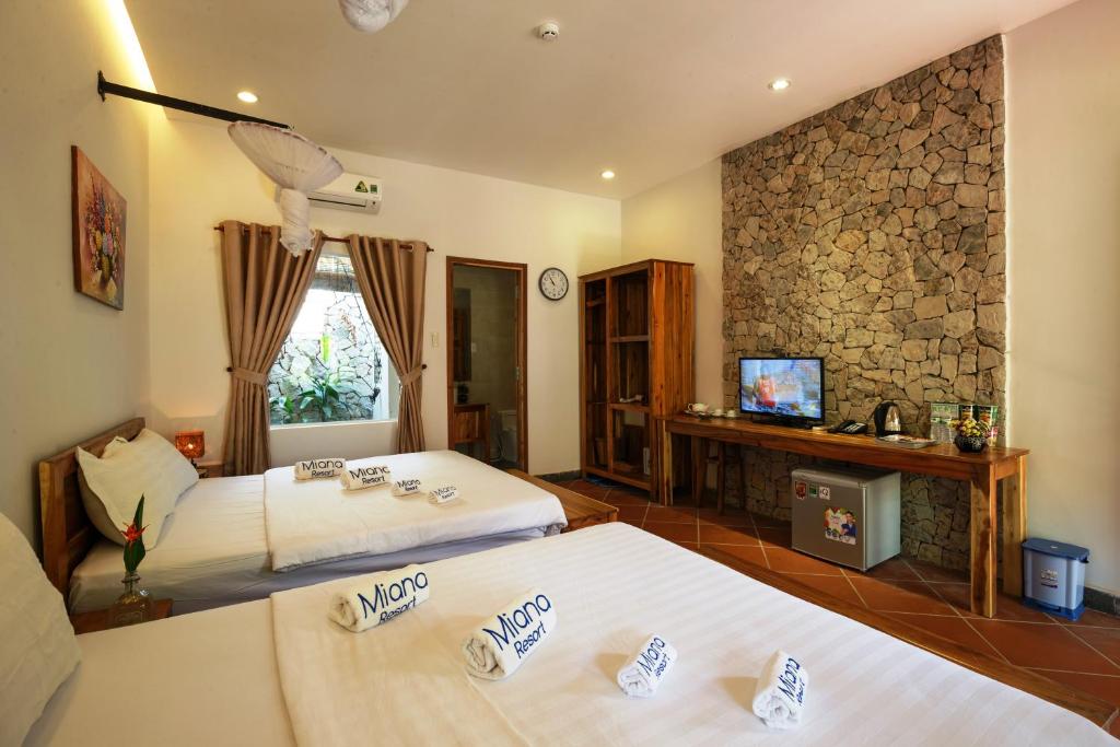 Postel nebo postele na pokoji v ubytování Miana Resort Phu Quoc