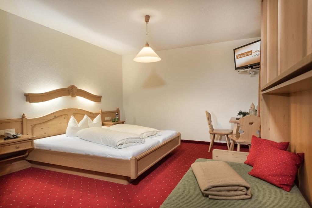 Postel nebo postele na pokoji v ubytování Das Wismeyer - Skihotel an der Plattenkarbahn