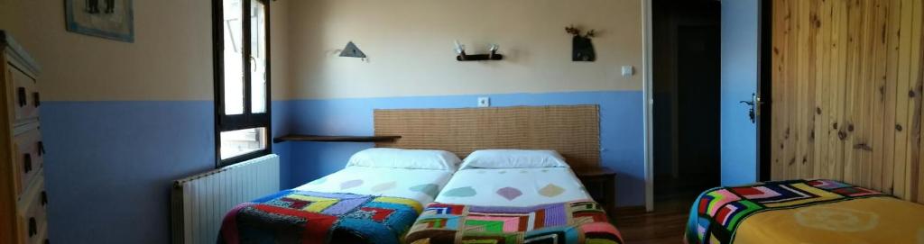 Postel nebo postele na pokoji v ubytování Albergue El Último Bucardo