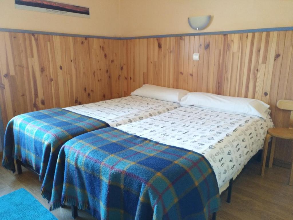 Postel nebo postele na pokoji v ubytování Albergue El Último Bucardo