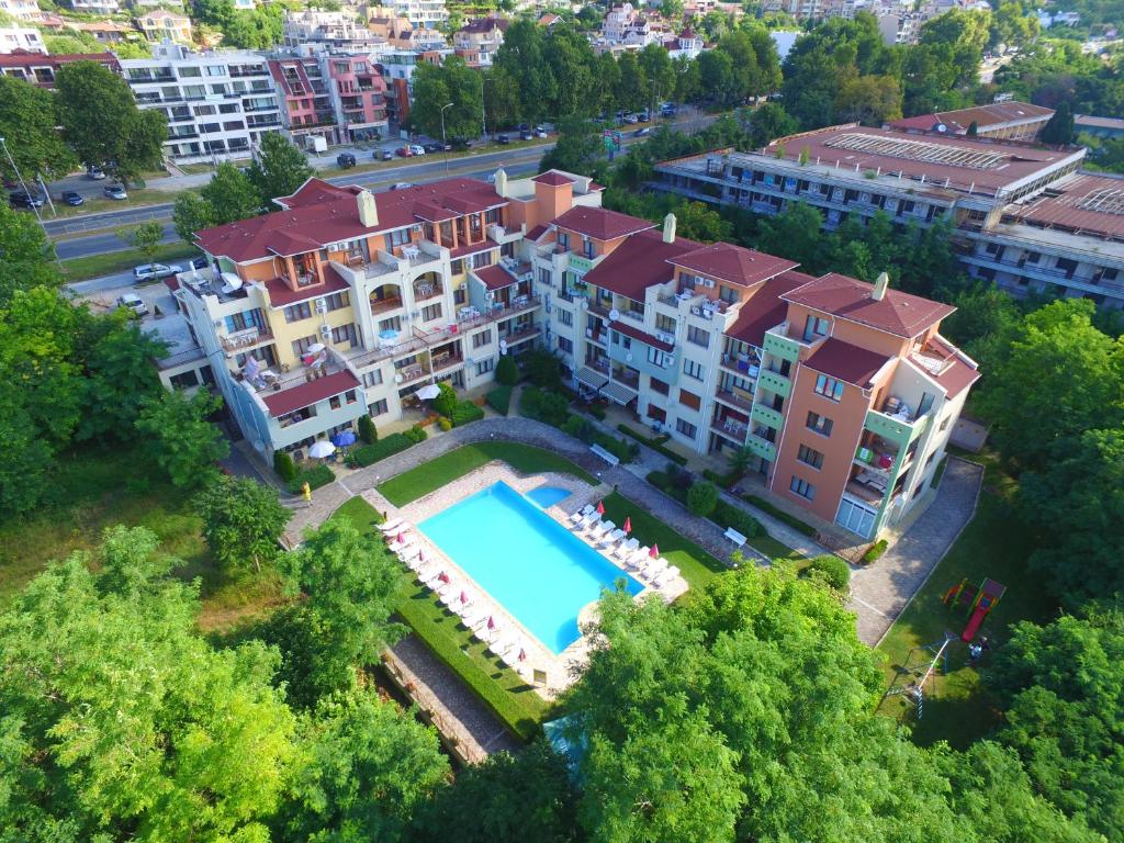 an aerial view of a building with a swimming pool at Sea Park Homes Neshkov in Varna City
