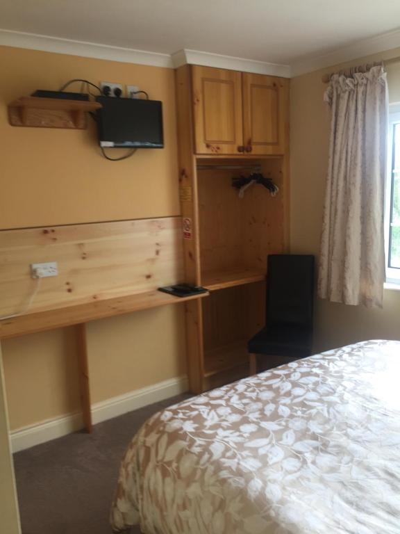 Postel nebo postele na pokoji v ubytování Algret House B&B