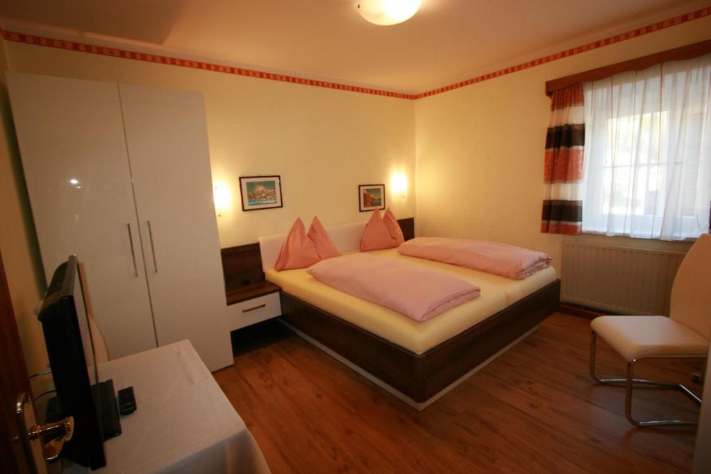 Postel nebo postele na pokoji v ubytování Hotel Stadlwirt