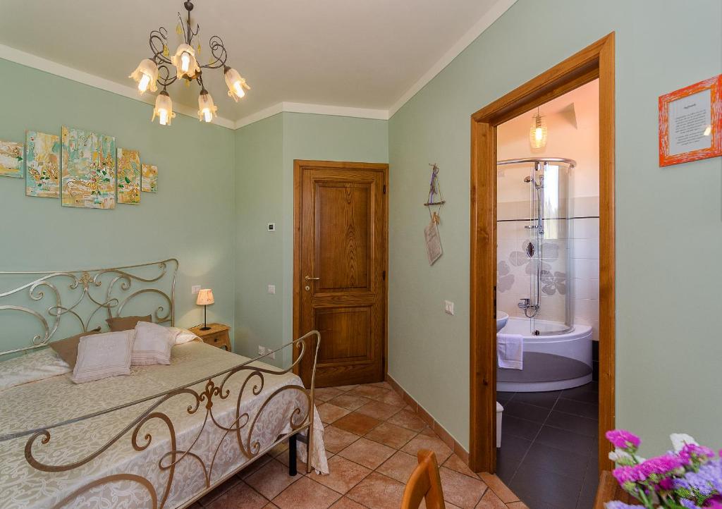 Postel nebo postele na pokoji v ubytování Agriturismo Ai Linchi