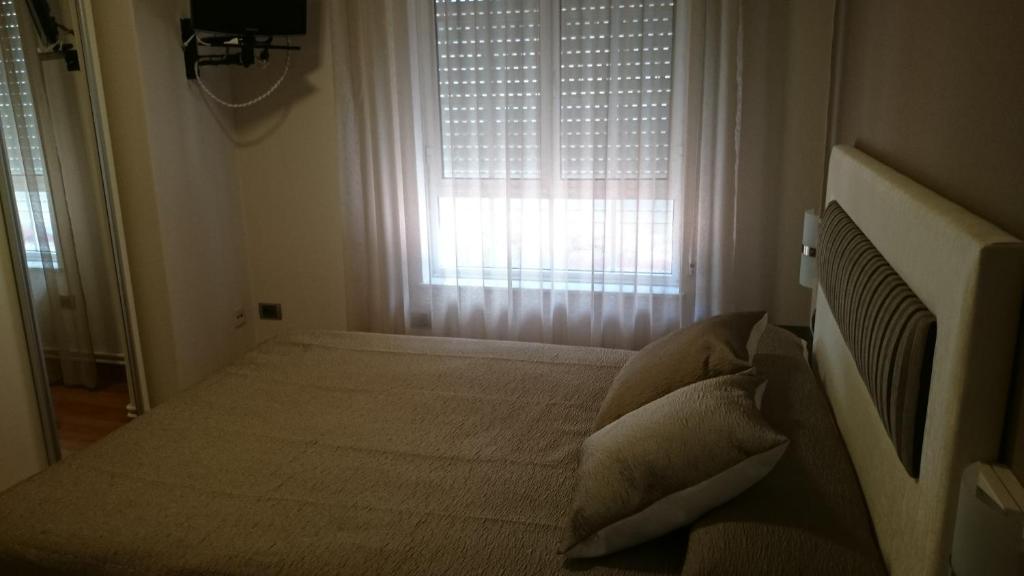 Posteľ alebo postele v izbe v ubytovaní Hotel El Millón