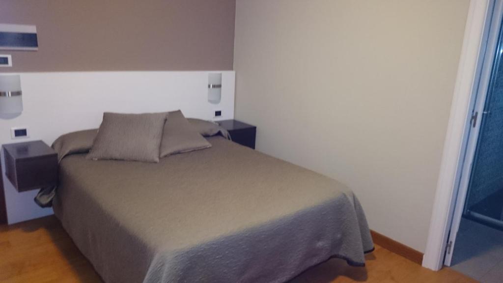Posteľ alebo postele v izbe v ubytovaní Hotel El Millón