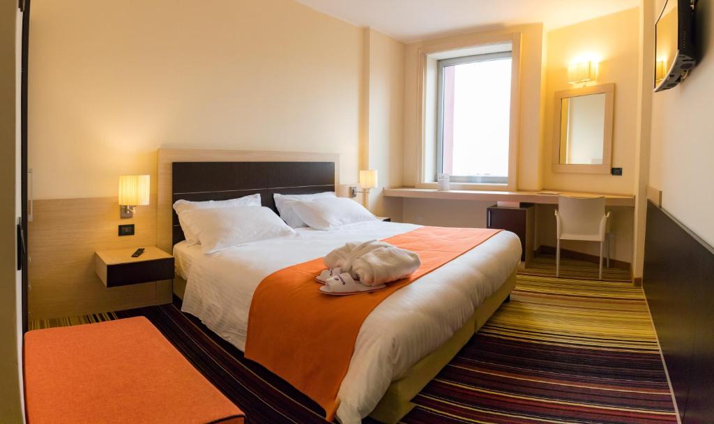 Postel nebo postele na pokoji v ubytování BV President Hotel