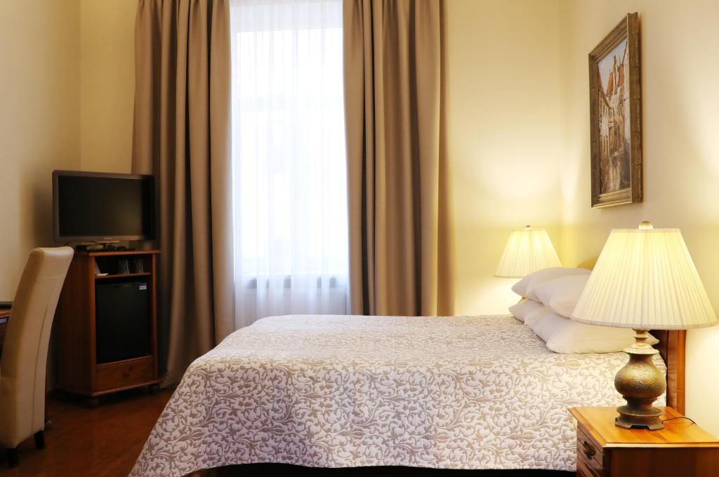 Postel nebo postele na pokoji v ubytování Old Riga Boutique Hotel "Vecriga"