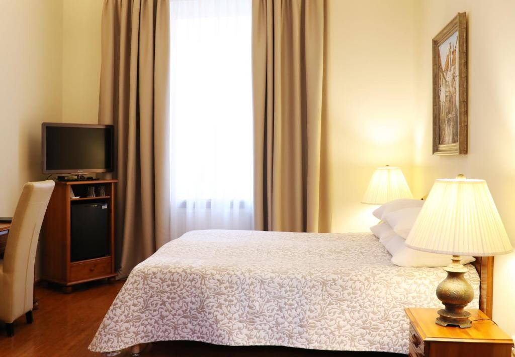 Postel nebo postele na pokoji v ubytování Old Riga Boutique Hotel "Vecriga"