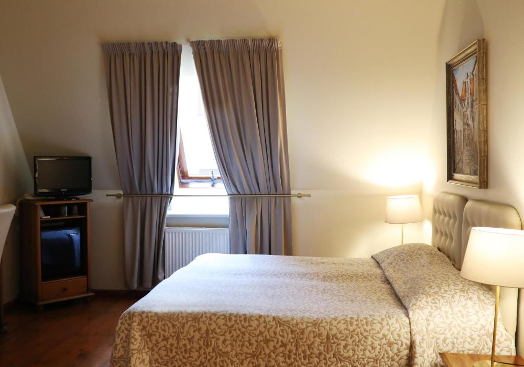 Postel nebo postele na pokoji v ubytování Old Riga Boutique Hotel "Vecriga"