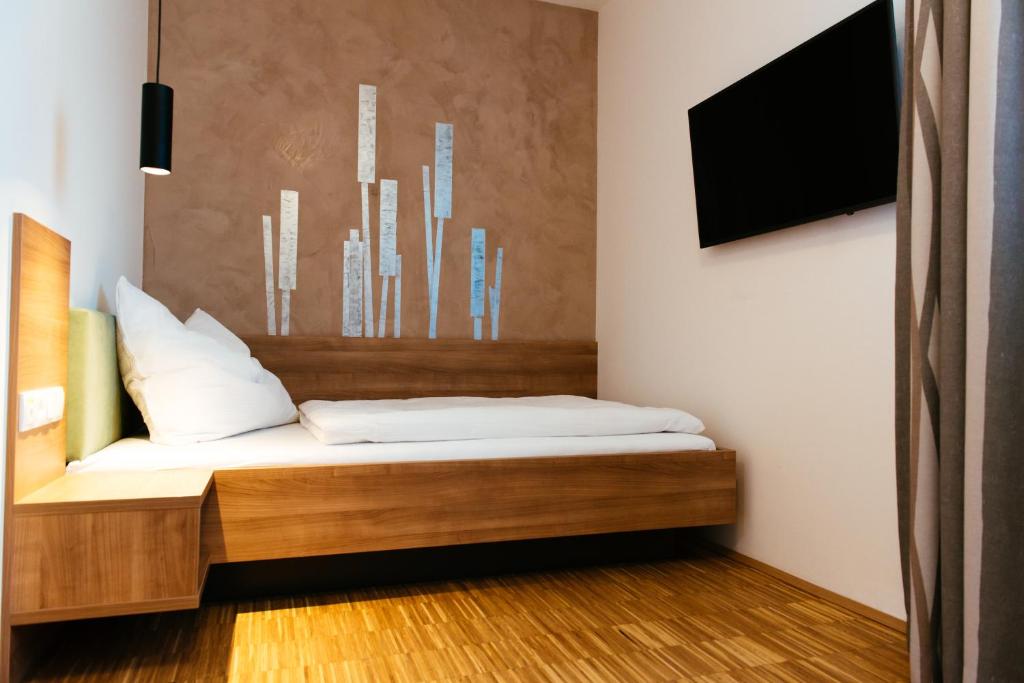 Postel nebo postele na pokoji v ubytování Aparthotel Heuberger