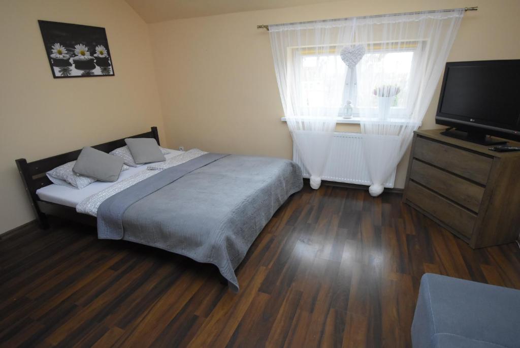 Posteľ alebo postele v izbe v ubytovaní Mazuria Apartamenty