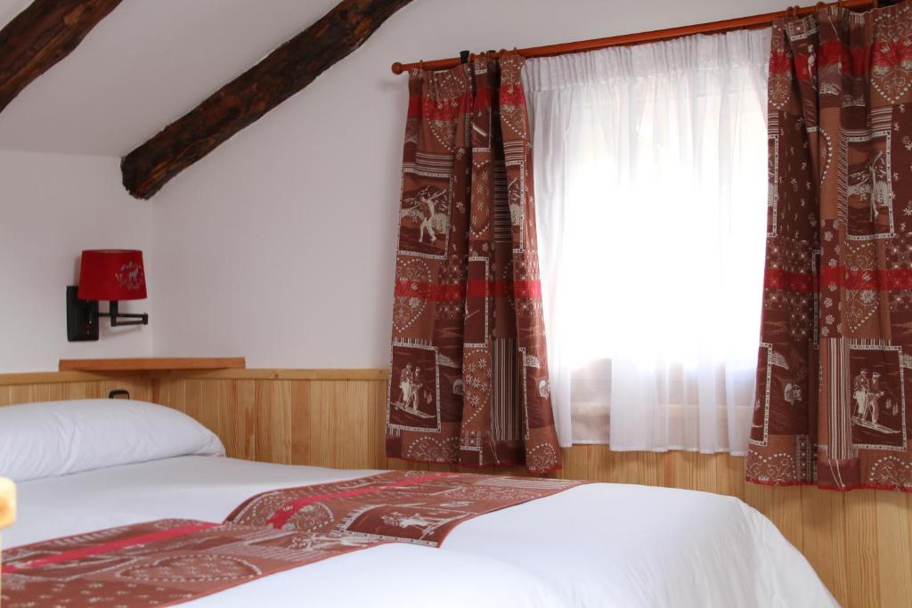 Postel nebo postele na pokoji v ubytování Hôtel Bruxelles