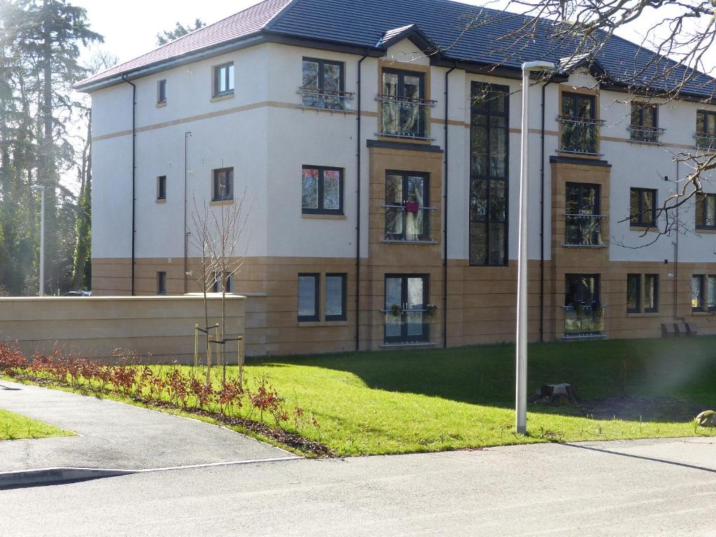 a large white building with a lot of windows at Hedgefield House Flat 34 in Inverness