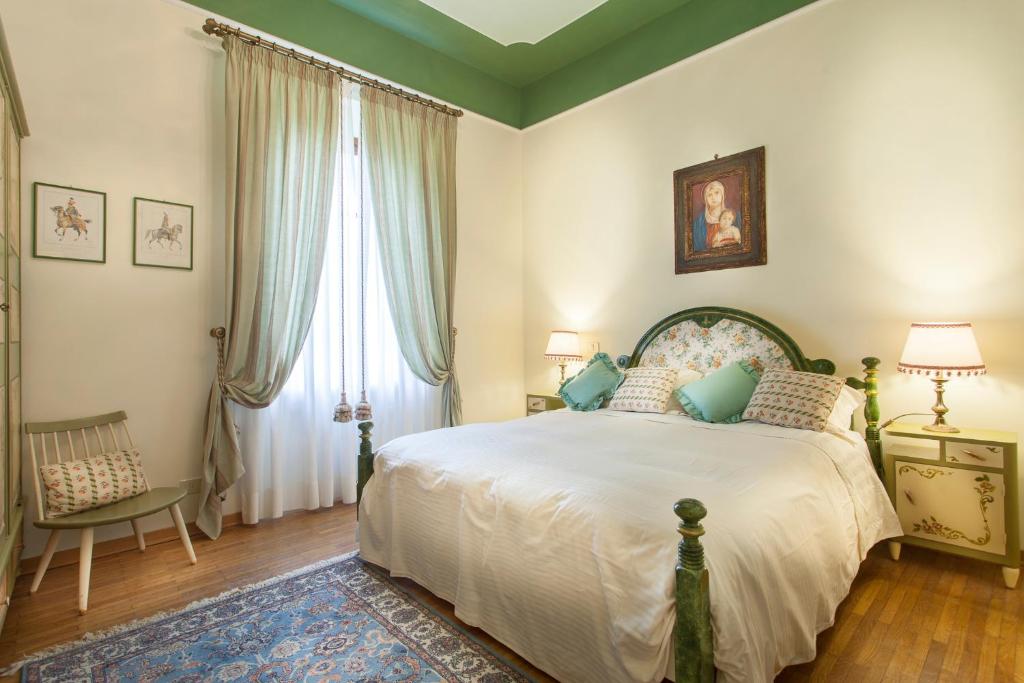 Postel nebo postele na pokoji v ubytování Villa Gobbi Benelli
