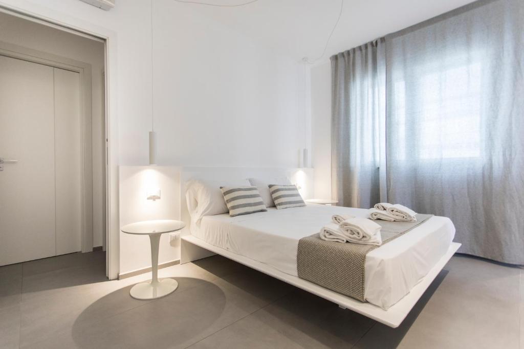 Postel nebo postele na pokoji v ubytování Le Ancore Luxury Apartments
